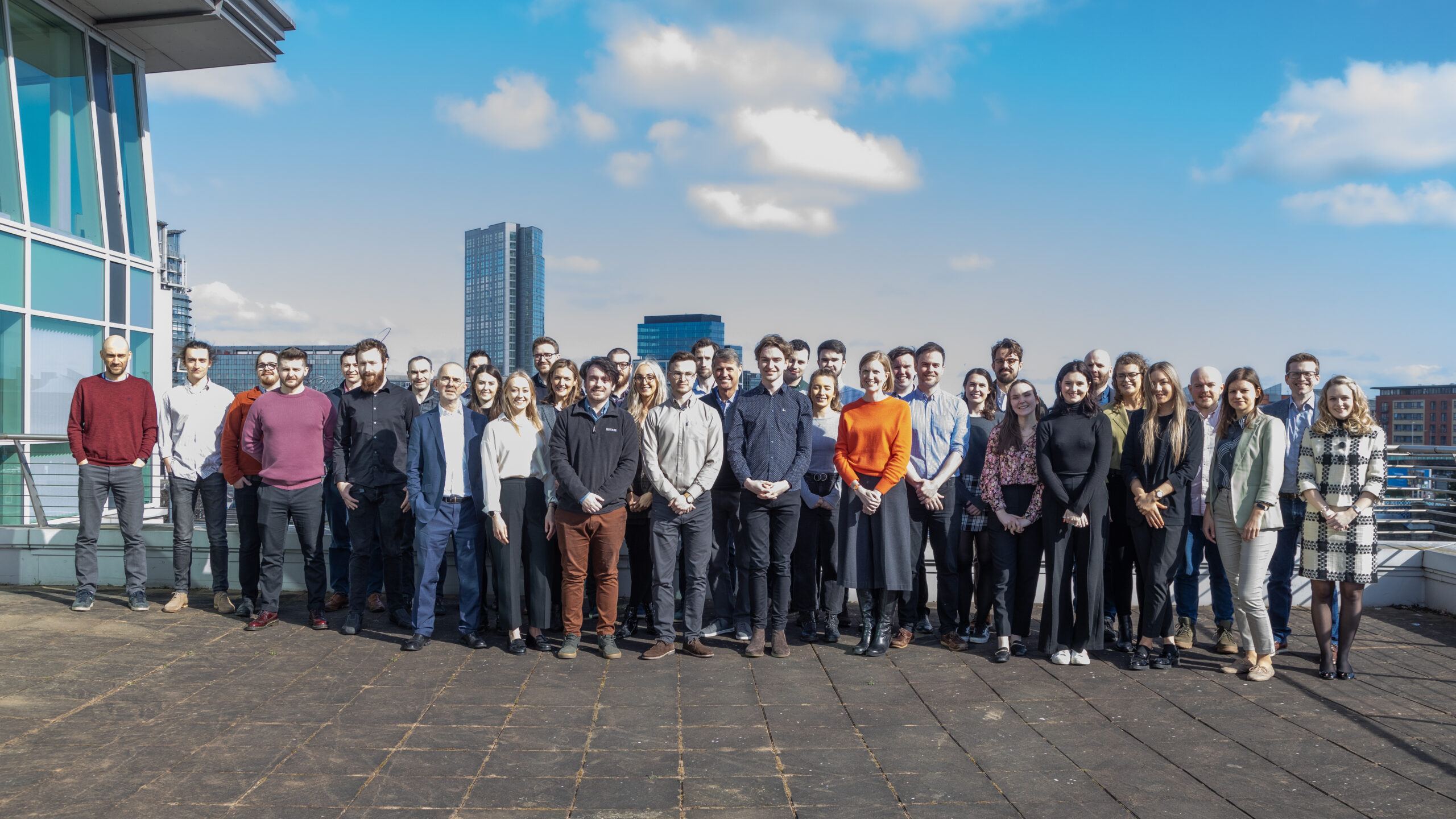 Datactics team 2022 on the balcony at One Lanyon Quay, Belfast